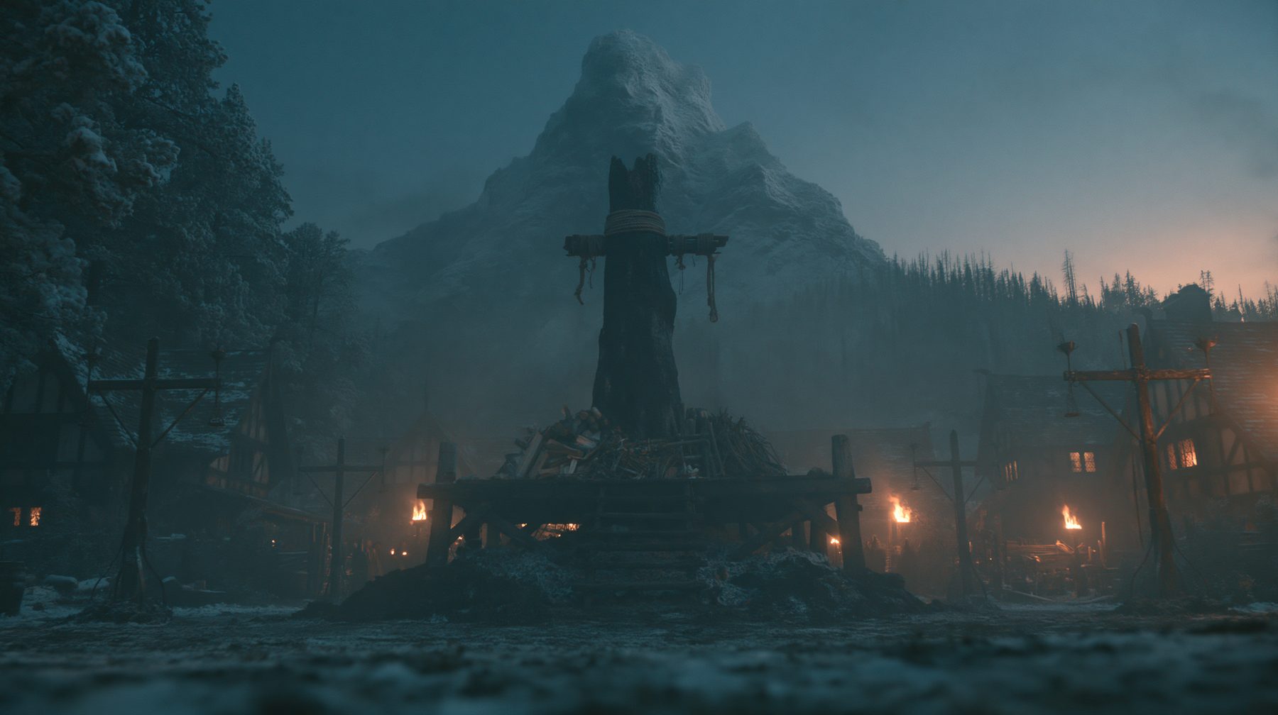 The execution ground at blue hour — snowy medieval village, scaffold and pyre beneath a mountain
